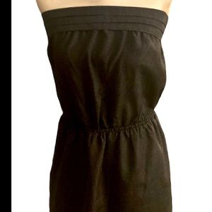 Women’s Large, preowned strapless, mini dress. Black with tiny white polka dots